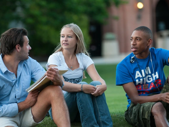 Students sitting on the University of Arizona Mall.