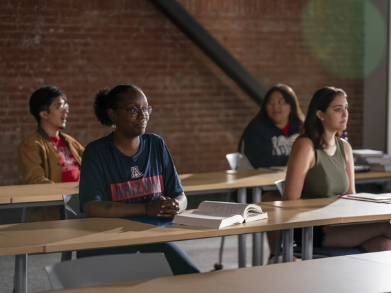 Group of students sitting at desks in a classroom.