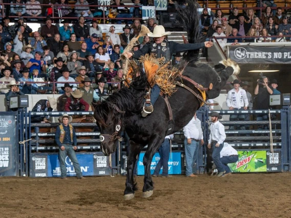 Photo of man riding horse